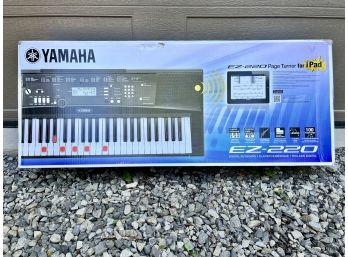 A New In Box Yamaha EZ-220 Electric Keyboard