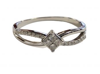 10K White Gold Diamond Ring Featuring 4 Princess Diamonds In The Center And 16 Round Diamonds Down The Sides