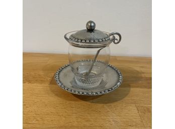 A Lidded Jam Jar With Tray And Spoon
