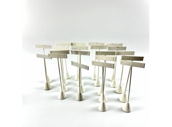 A Group Of 20 Leather Wrapped Earring Display Stands - Weighted