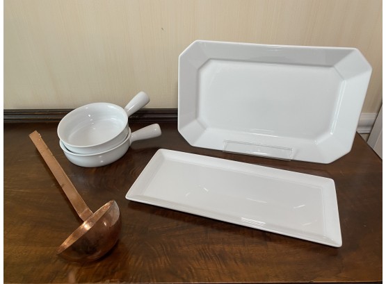 White Platters, Bowls And Copper Ladle