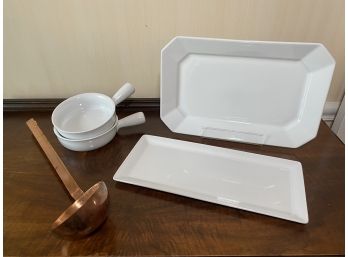 White Platters, Bowls And Copper Ladle