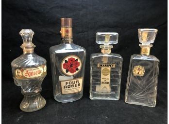 Anisette, Four Roses, I.W. Harper, And Seven Crown Liquor Bottles
