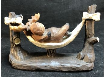 Wooden Carved Moose In A Hammock
