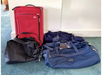Red Swiss Army Soft Sided Rolling Suitcase And Assorted Duffles