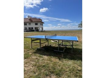 A Joola Outdoor Ping Pong Table - Folding - On Wheels