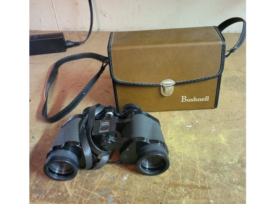 Vintage Bushnell Binoculars.  .              .        (Loc: Garage Cab 2)