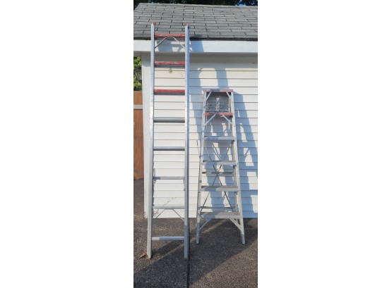 Pair Of Aluminum Ladders.             .               ( Loc Shed Left Door )