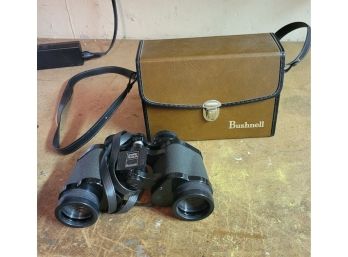 Vintage Bushnell Binoculars.  .              .        (Loc: Garage Cab 2)