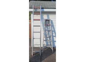 Pair Of Aluminum Ladders.             .               ( Loc Shed Left Door )