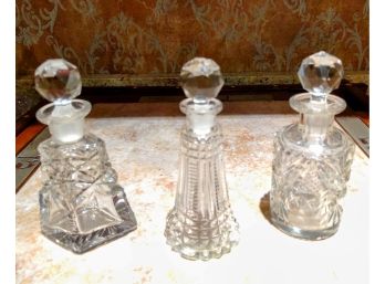 Three Vintage Crystal Perfume Bottles With Round Stoppers