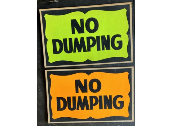 TWO BRIGHT 'NO DUMPING' SIGNS