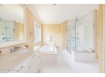 A Large Double Vanity Including Stone Counter, Kohler Sinks And Kohler Faucets