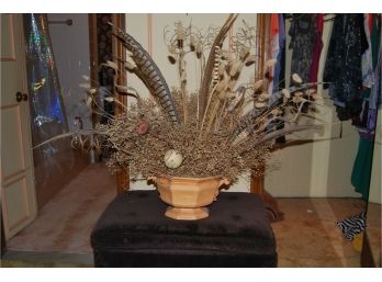 A Feather And Flower Arrangement