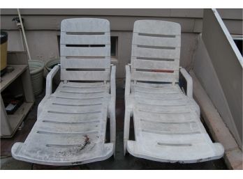 Two Outdoor Plastic Lounge Chairs