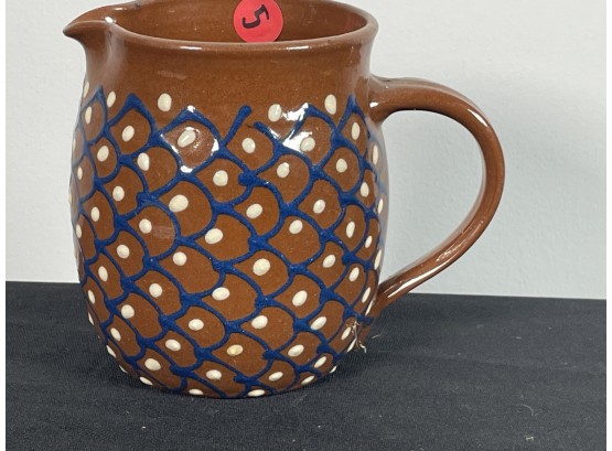 REDWARE PITCHER WITH BLUE DIAMOND AND WHITE DOT DECORATION
