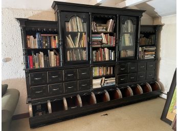 A LARGE BLACK PAINTED AND STENCILED COUNTRY STORE CABINET