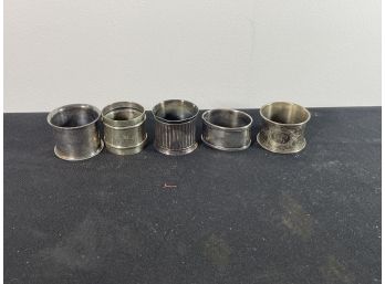 FIVE ANTIQUE NAPKIN RINGS, ONE MARKED STERLING