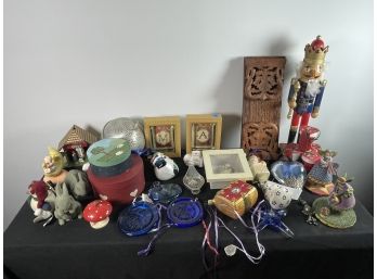 LARGE GROUPING OF DECORATIVE ITEMS INCLUDES A NUTCRACKER, XMAS ORNAMENTS, GIANT TEA BALL, AND MORE