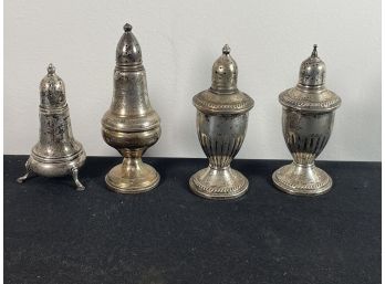 FOUR STERLING SILVER SALT AND PEPPER CASTERS