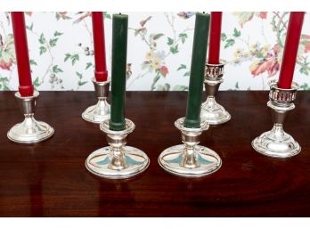 Three Pairs Of Weighted Silver Candlestick Holders
