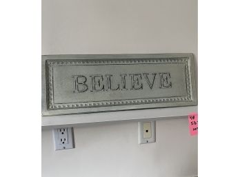 A Metal 'Believe' Sign