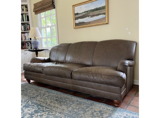 An 82' Leather Rolled Arm 3 Cushion Tight Back Sofa