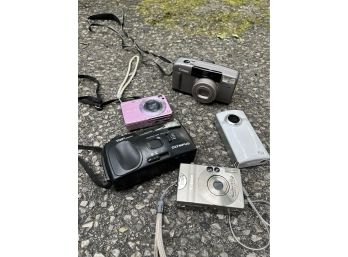 An Assortment Of Digital And 35mm Cameras