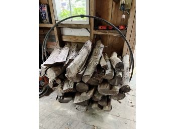 A Wrought Iron Round Log Holder