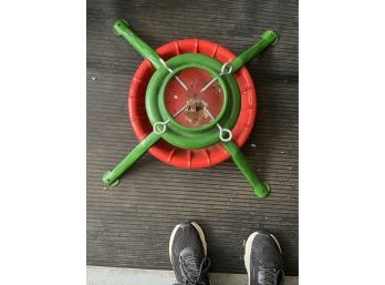 A Traditional Red And Green Christmas Tree Stand