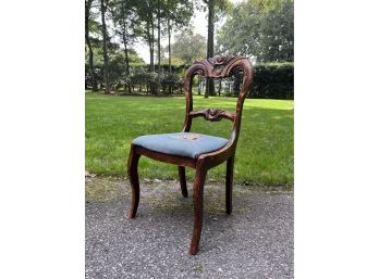 An Antique Carved Side Chair With Needle Point Seat