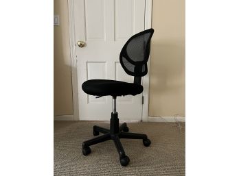 An Adjustable Desk Chair With Mesh Back On Wheels