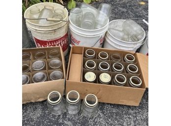 A Collection Of Glass Canning Jars