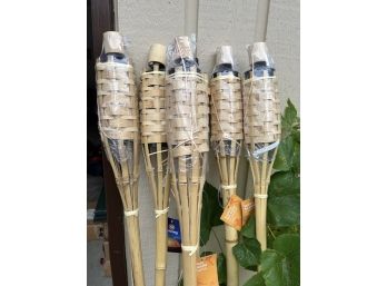 A Set Of 6 New Tiki Torches
