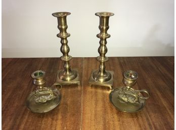Two Sets Of Brass Candlesticks