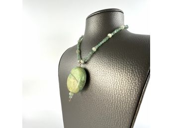 A Turquoise Pendant With Aventurine Beads