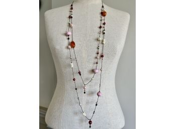 A Double Strand Beaded Necklace With Colorful Stones