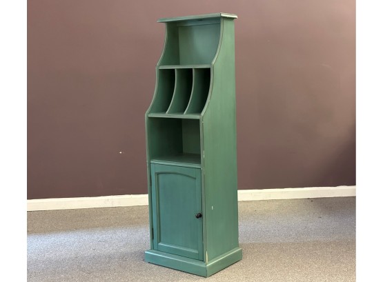 A Small Cabinet In Green By Pier 1