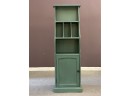 A Small Cabinet In Green By Pier 1