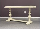 A Vintage Console Table In A Creamy White Painted Finish