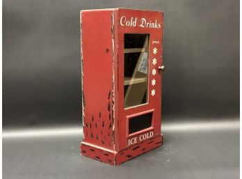 A Miniature Retro Coca-Cola Vending Machine Cabinet