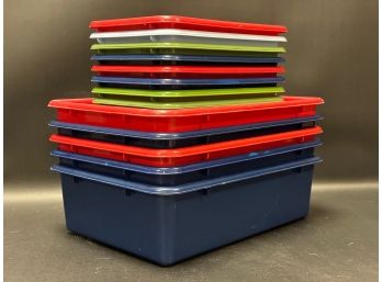A Stack Of Colorful Storage Tubs