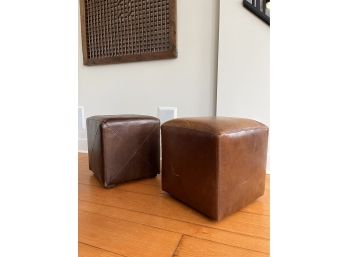 A Pair Of Leather Ottomans