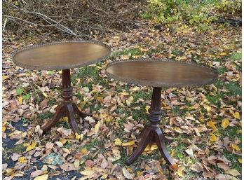 A Pair Of Unique Oval Tables With Intricate Metal Detail