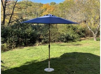 A Blue 8 Foot Umbrella With Base