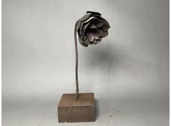 A Unique Metal Flower Statue On Wood Base