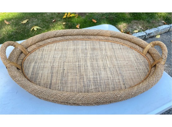 An Oval Woven Tray With Handles - 29' Long