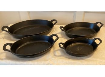 A Set Of FOUR STAUB Cast Iron Oval Baking Dishes Made In France