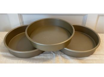A Group Of Three Cake  Pans  One With Removeable Bottom