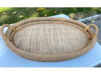 An Oval Woven Tray With Handles - 29' Long